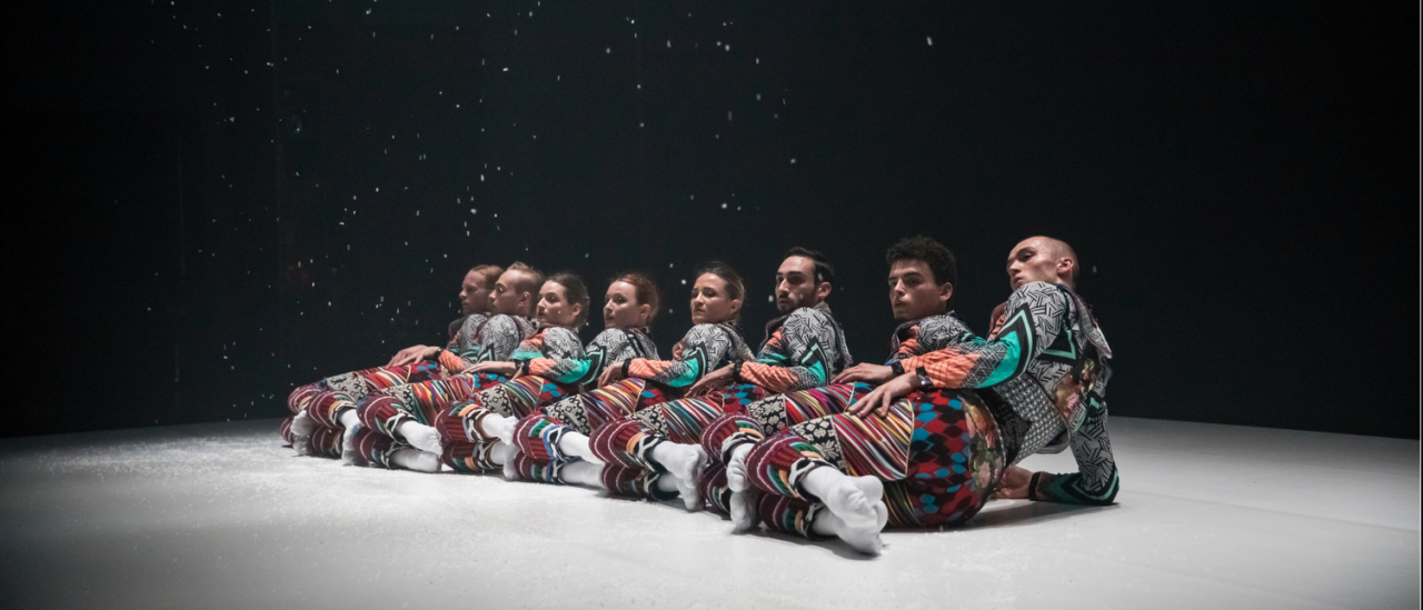 Tundra image, dancers on the floor and snow falling