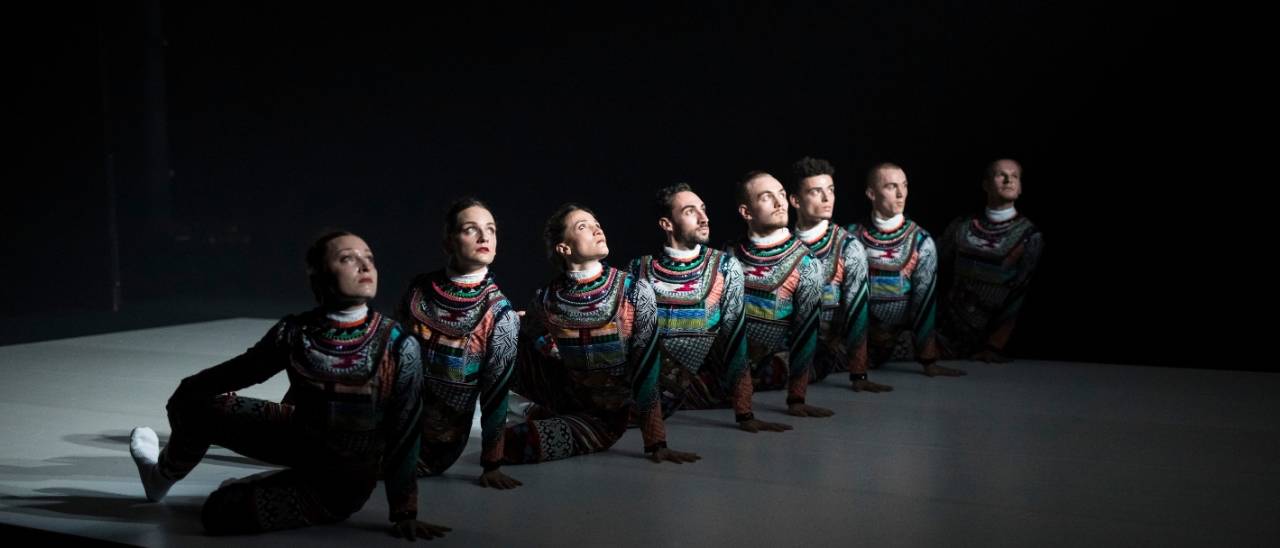 Tundra all dancers in a row with right arm in the air at a right angle