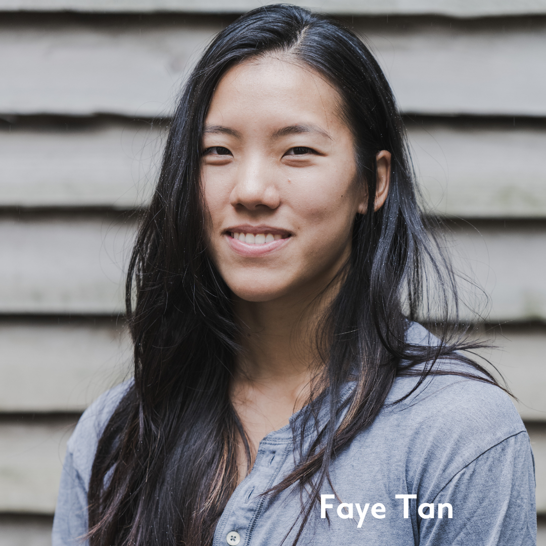 Faye tan smiles in a blue top
