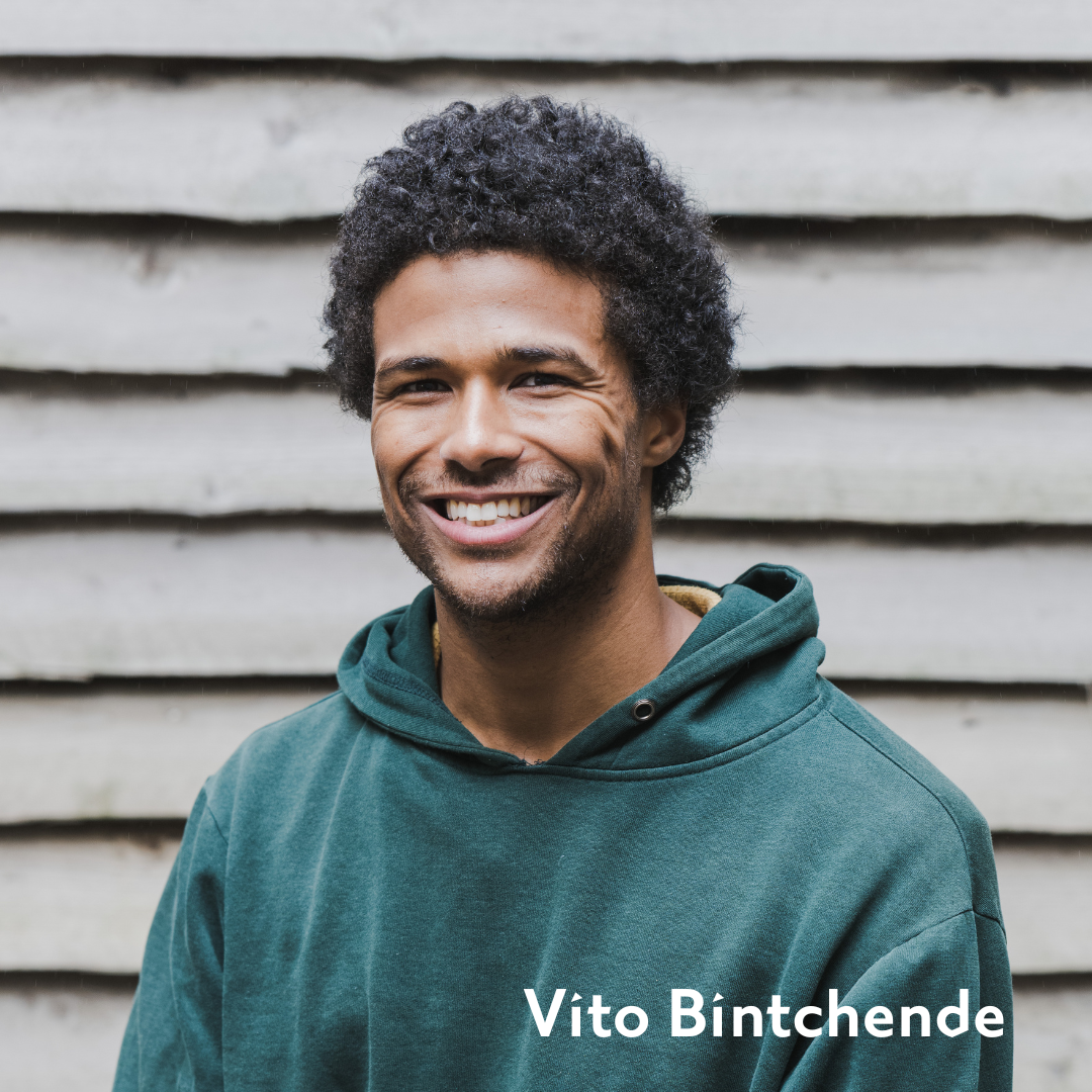 Vito headshot, smiling in a green hoodie