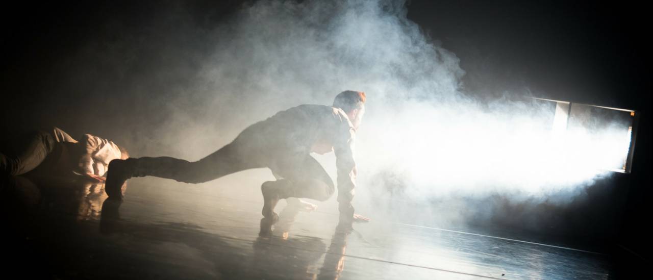 dancer looking into smoke