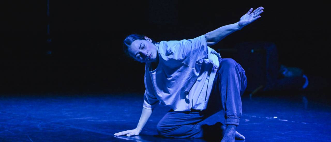 dancer in blue lighting