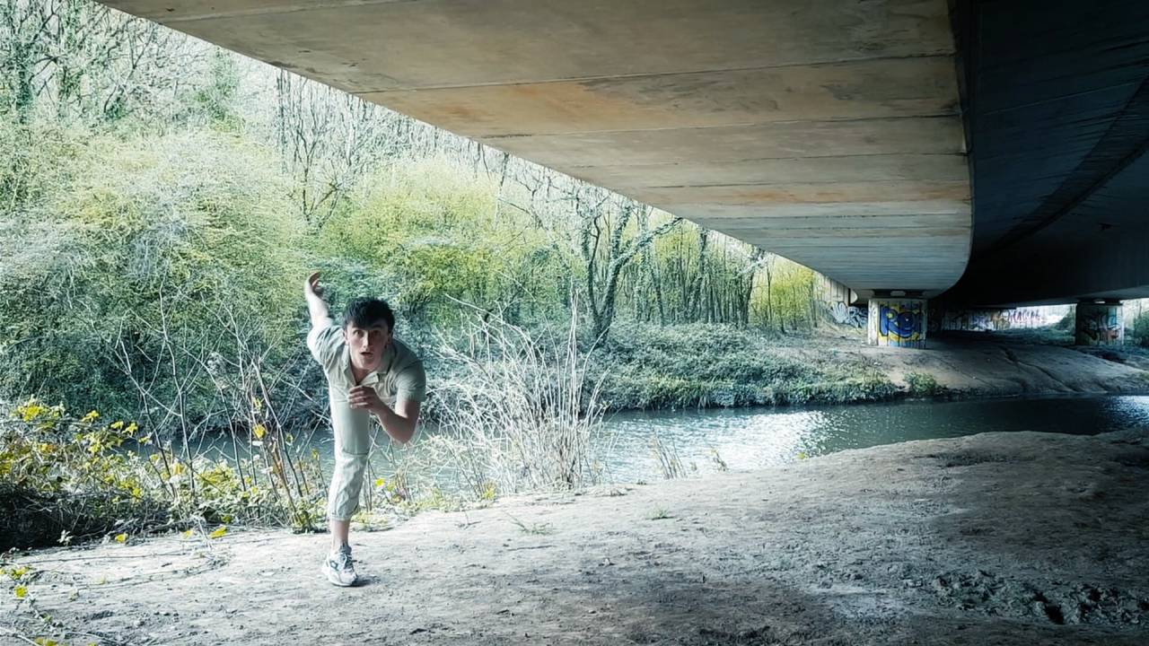 mei dancing under a bridge