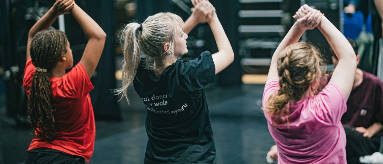 Image of Faye dancing with associates