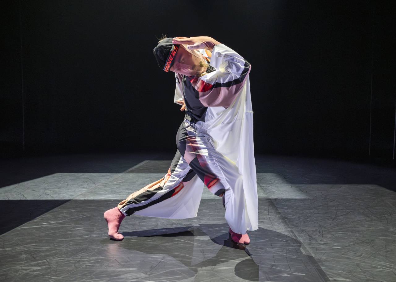 Ed performing in Profundis, being lifted by 4 other dancers