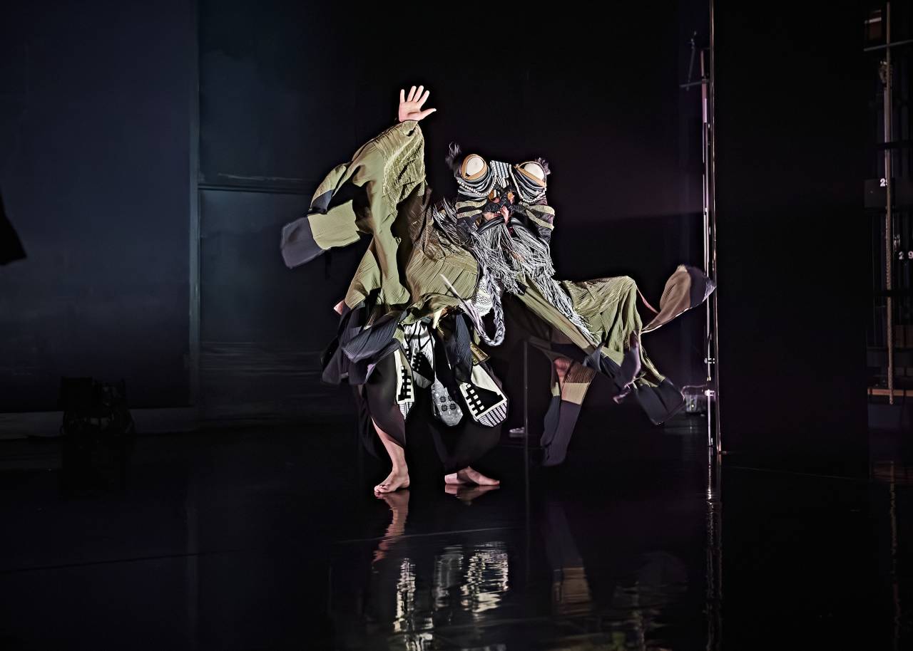 Ed performing in Profundis, being lifted by 4 other dancers