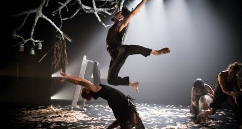 Folk main image leaping over dancer