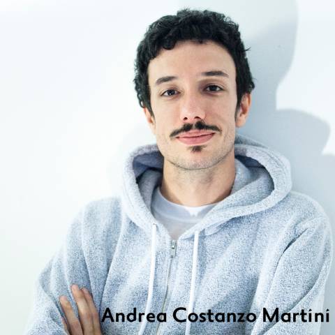 Andrea Costanzo Martini has black hair and mustache and wears a grey hoodie